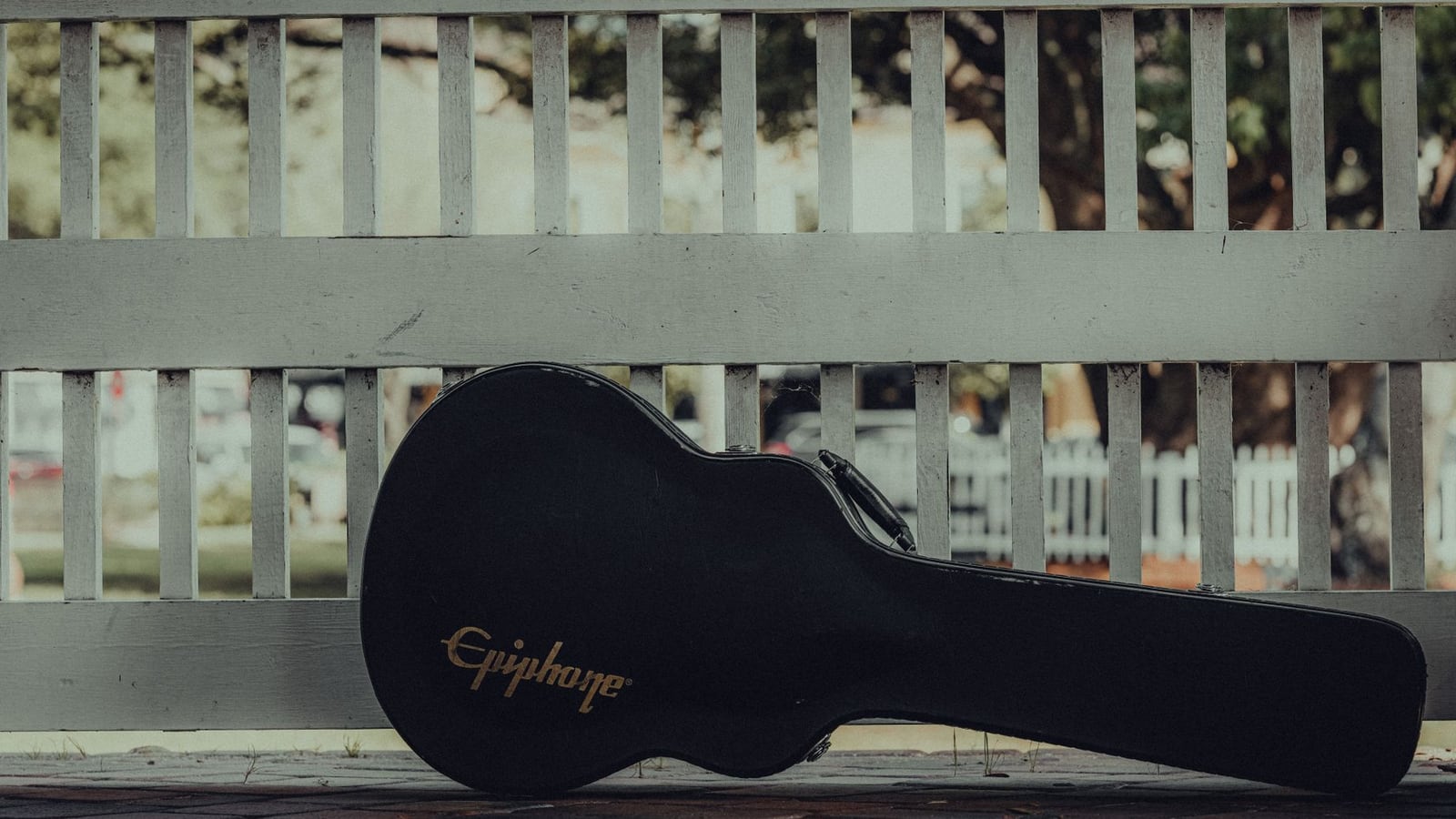 Guitar stored in a hard case with a hygrometer for seasonal humidity control